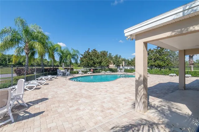 a view of a grassy field with an trees
