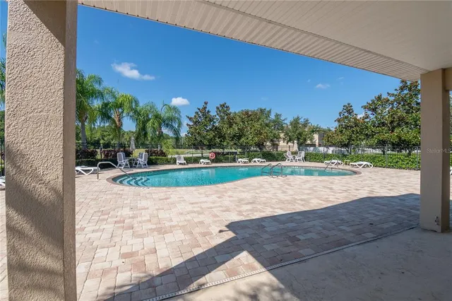a backyard with a table and chair