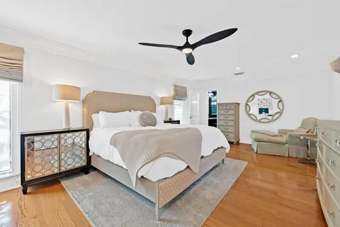 a bed room with a bed and a chandelier