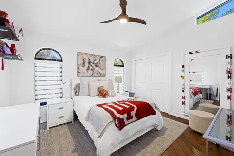 a bedroom with a bed and a couch