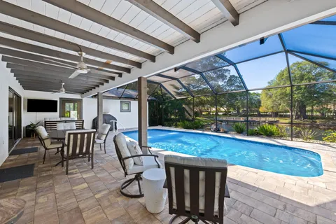 a view of a patio with a table chairs and a patio