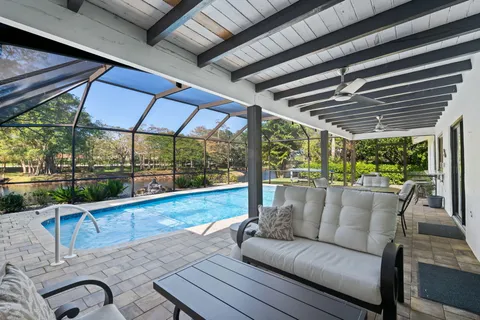 a view of swimming pool with a patio