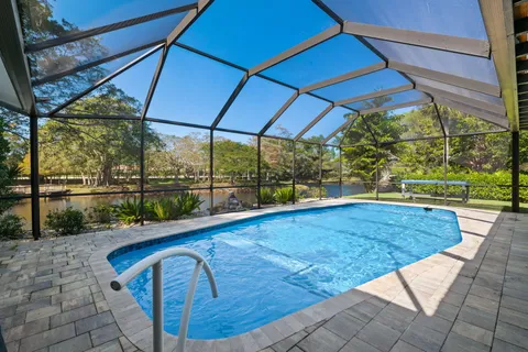 a view of a swimming pool with a patio