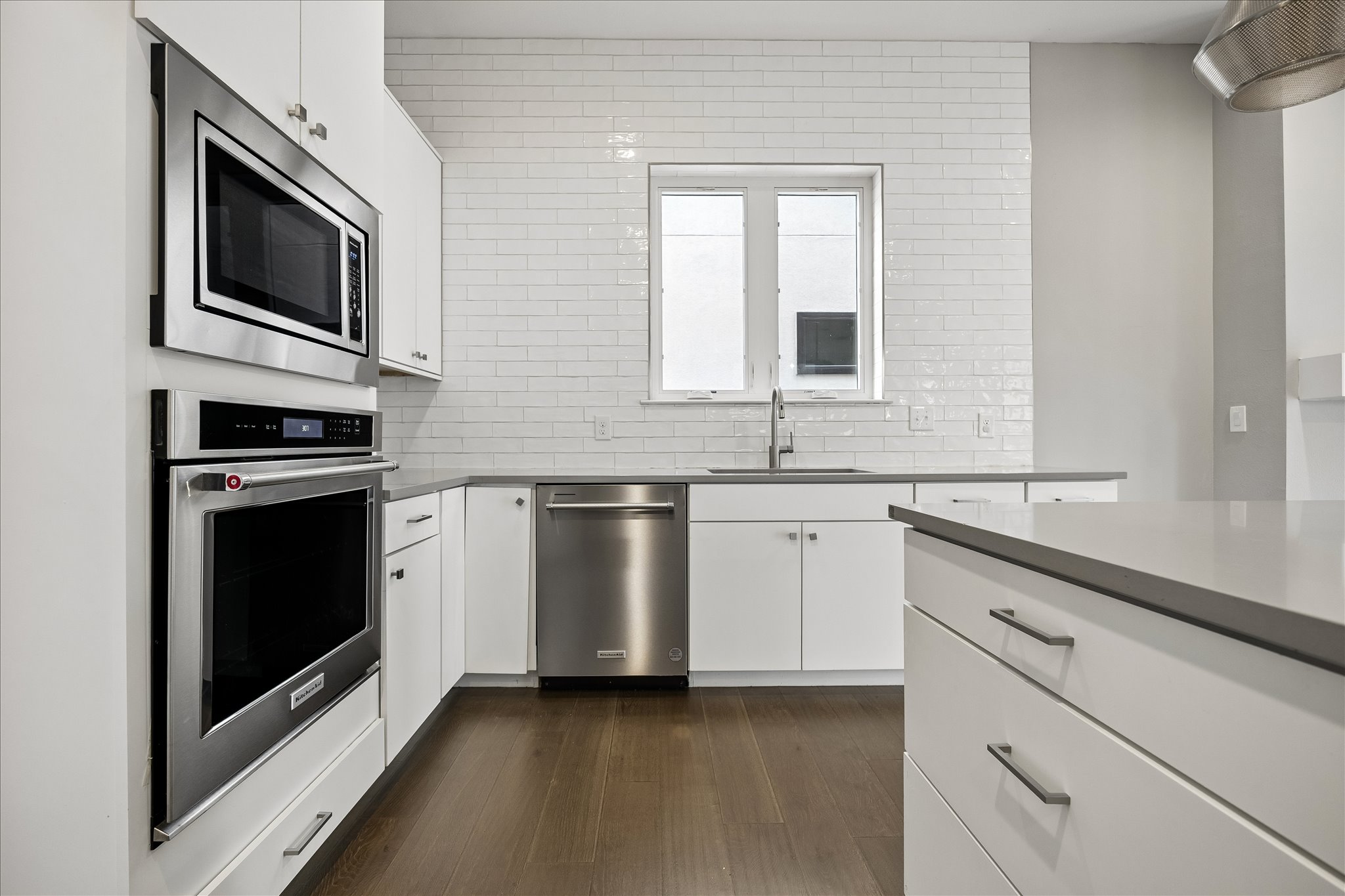 5006 Pecan Springs Road, Unit 6 Austin, TX 78723 - Photo 14 of 30 A well-appointed kitchen features stainless steel appliances and durable hardwood flooring.