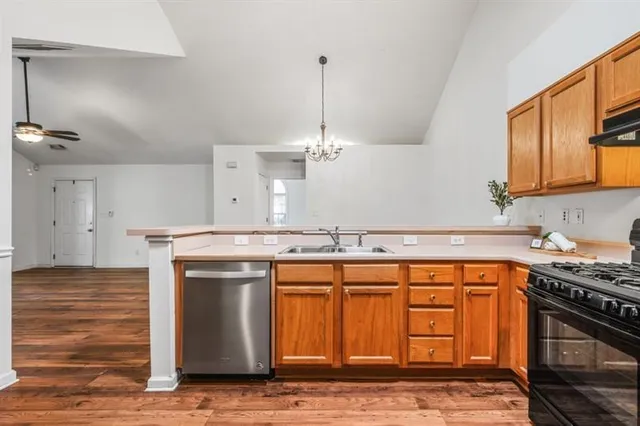 a kitchen with a stove and a sink