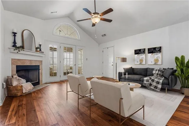 a living room with furniture and a fireplace