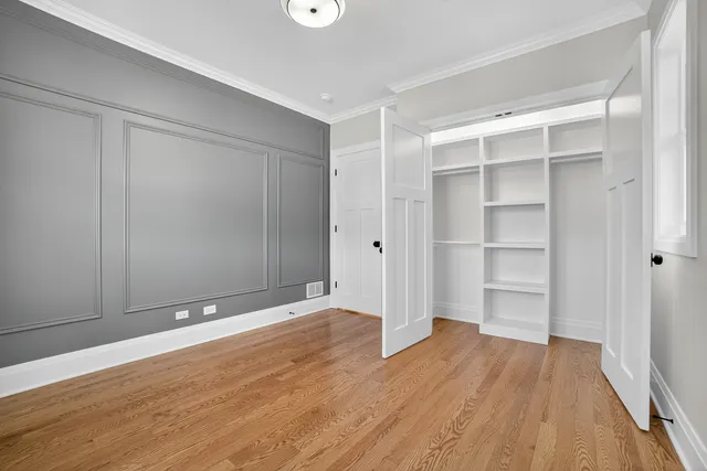 a bathroom with a bathtub shower sink vanity and mirror