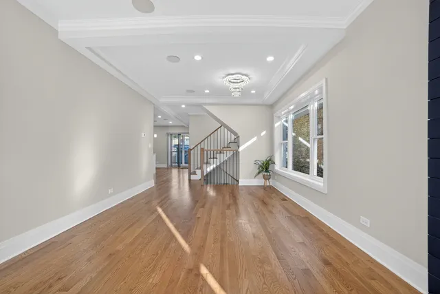 a view of an entryway with wooden floor