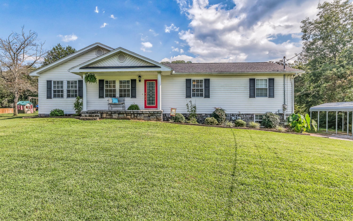 a front view of a house with a yard
