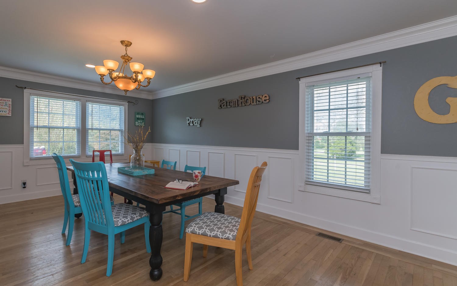 3798 Dutch Valley Road Clinton, TN 37716 - Photo 14 of 37 a view of a dining room with furniture a chandelier and wooden floor