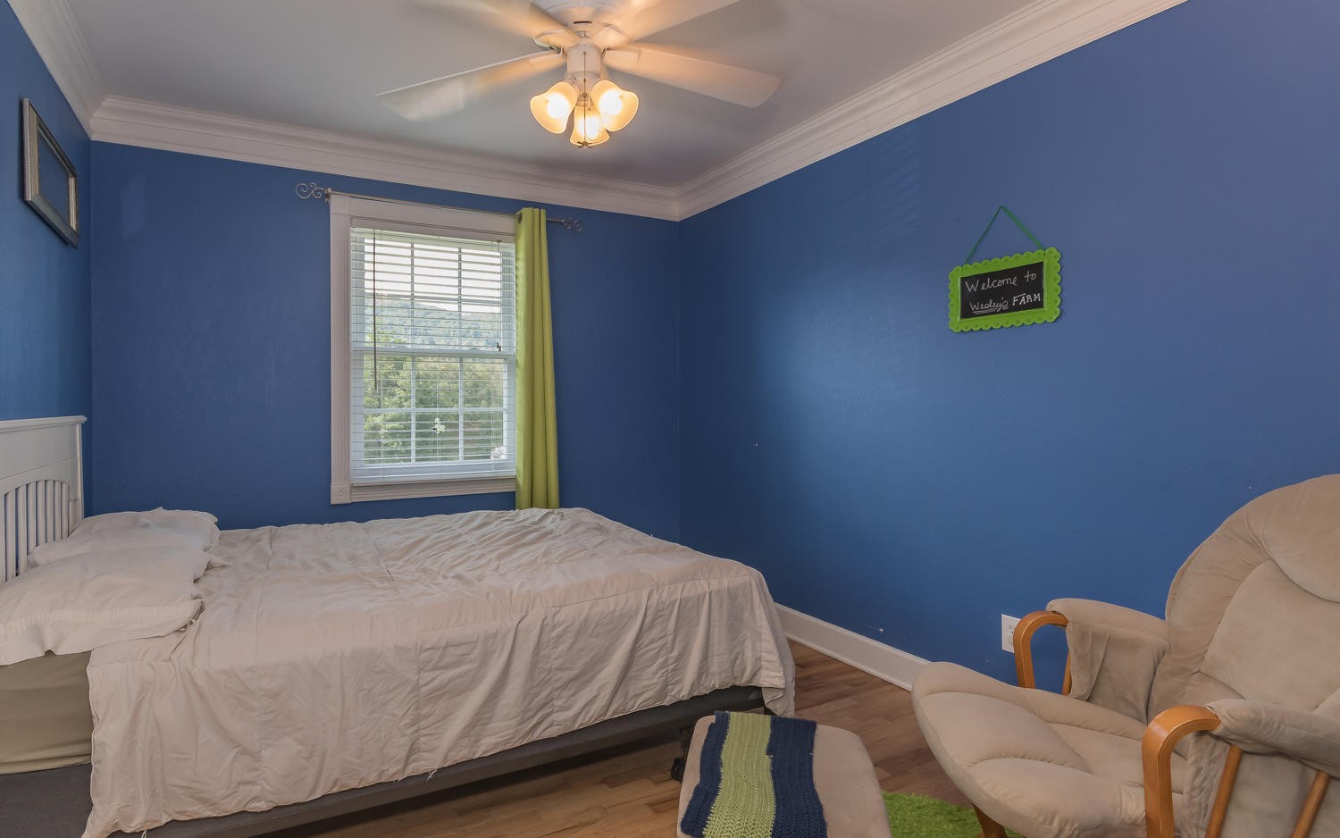 3798 Dutch Valley Road Clinton, TN 37716 - Photo 21 of 37 a bedroom with a bed and a couch