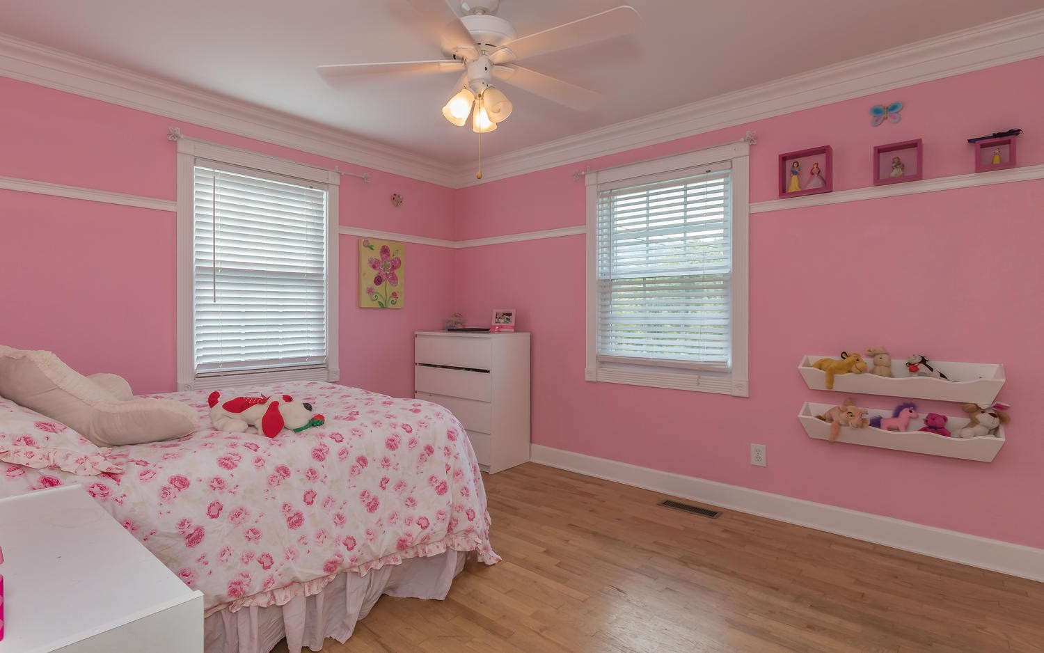 3798 Dutch Valley Road Clinton, TN 37716 - Photo 22 of 37 a bedroom with a bed and a chandelier
