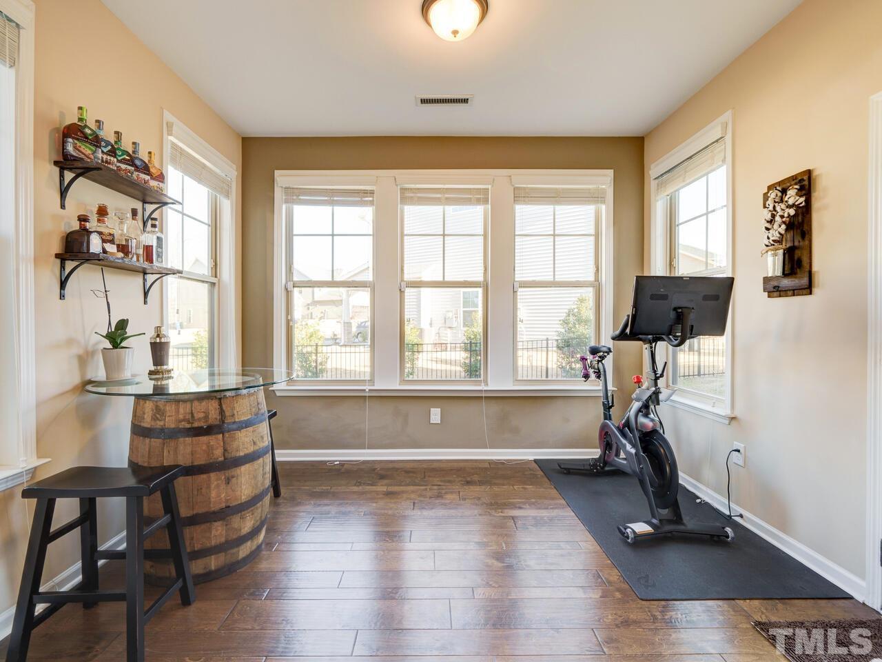 207 Maple Walk Street Durham, NC 27703 - Photo 11 of 50 a living room with furniture large window and wooden floor