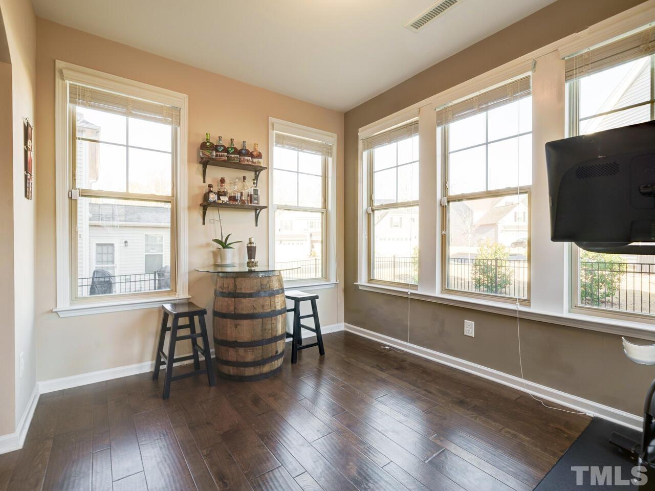 207 Maple Walk Street Durham, NC 27703 - Photo 12 of 50 a living room with furniture and a flat screen tv