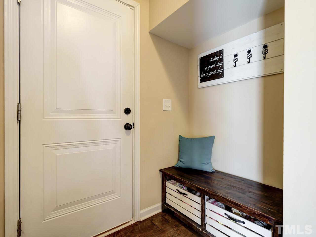 207 Maple Walk Street Durham, NC 27703 - Photo 14 of 50 a view of an empty room with wooden floor