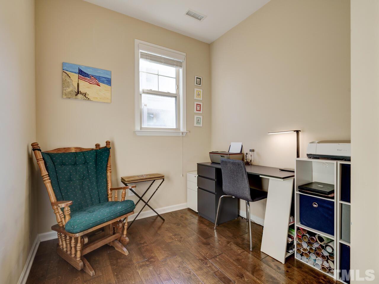 207 Maple Walk Street Durham, NC 27703 - Photo 15 of 50 a living room with furniture a rug and a window