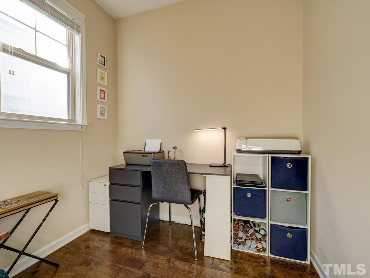 207 Maple Walk Street Durham, NC 27703 - Photo 16 of 50 a living room with furniture a rug and a window