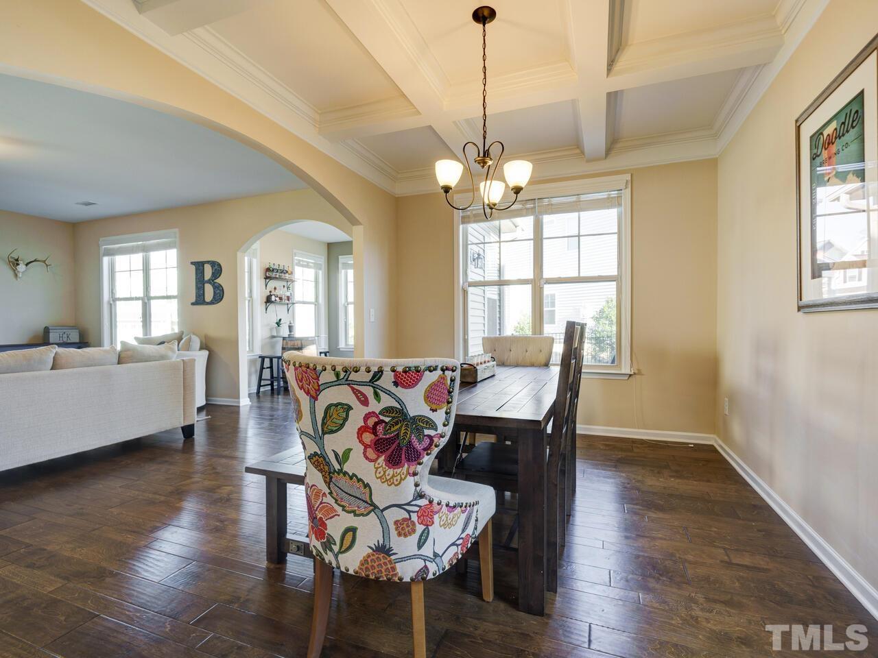 207 Maple Walk Street Durham, NC 27703 - Photo 17 of 50 a view of a dining room with furniture window and wooden floor