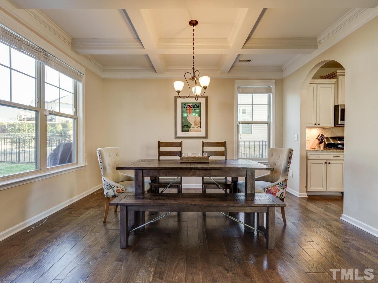 207 Maple Walk Street Durham, NC 27703 - Photo 18 of 50 a view of a dining room with furniture window and wooden floor