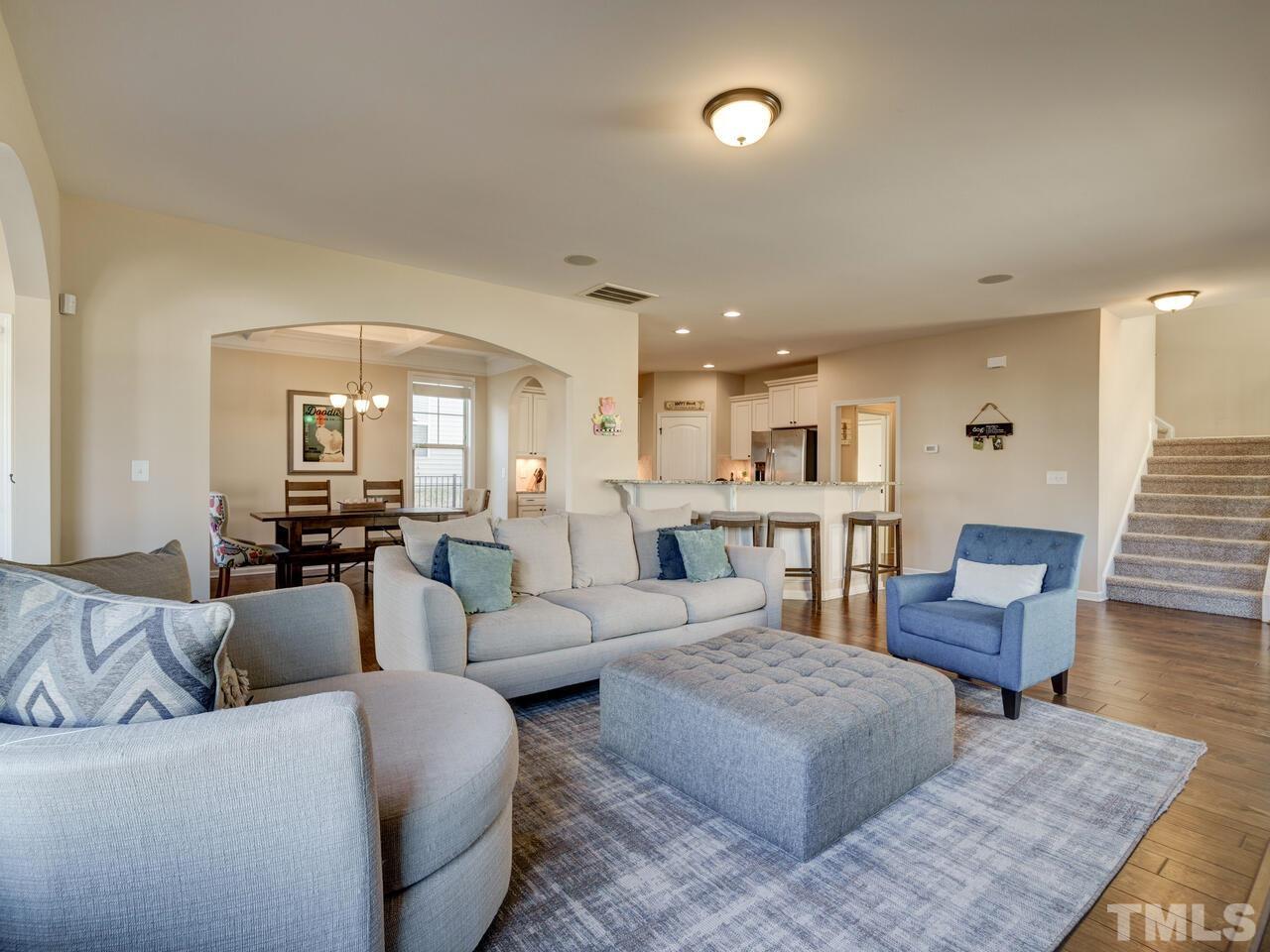207 Maple Walk Street Durham, NC 27703 - Photo 21 of 50 a living room with furniture and wooden floor
