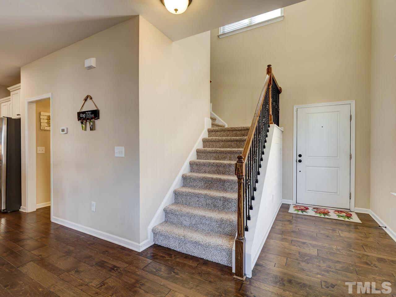 207 Maple Walk Street Durham, NC 27703 - Photo 28 of 50 a view of an entryway with wooden floor