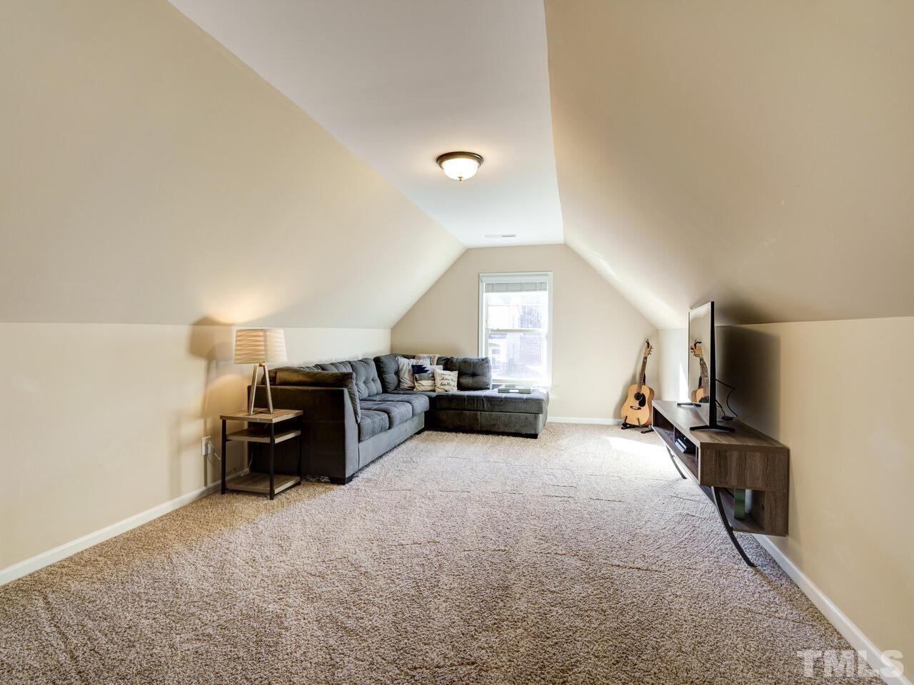 207 Maple Walk Street Durham, NC 27703 - Photo 29 of 50 a view of a livingroom with furniture and a window