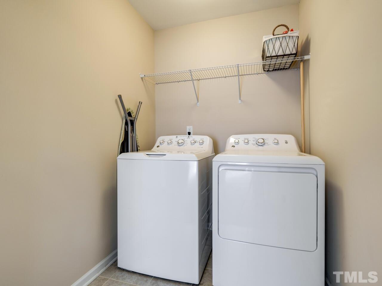 207 Maple Walk Street Durham, NC 27703 - Photo 39 of 50 a utility room with dryer and washer