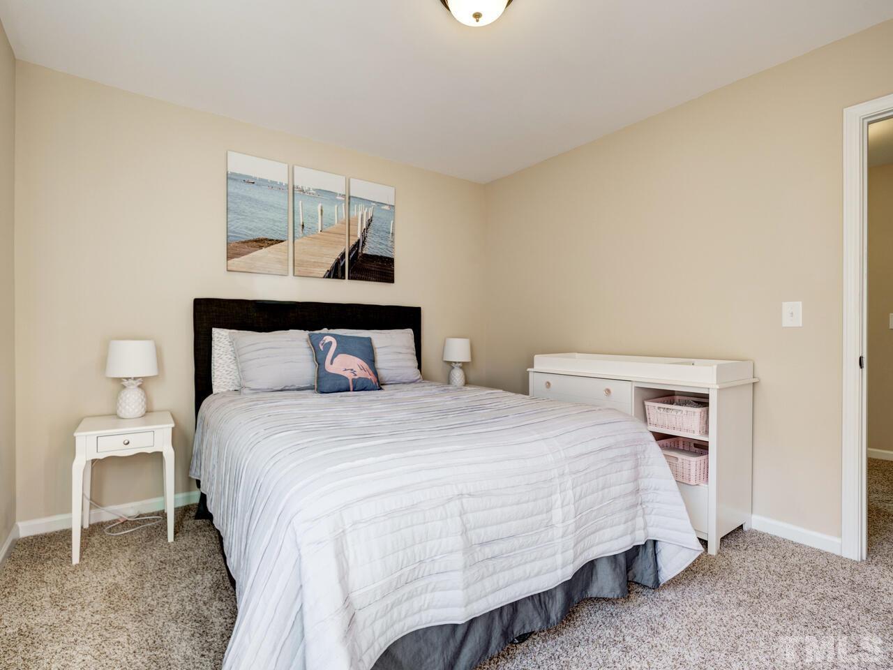 207 Maple Walk Street Durham, NC 27703 - Photo 42 of 50 a bedroom with a bed and window