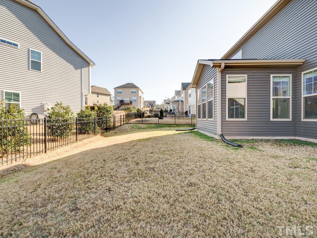 207 Maple Walk Street Durham, NC 27703 - Photo 44 of 50 a view of a house with a yard and pathway