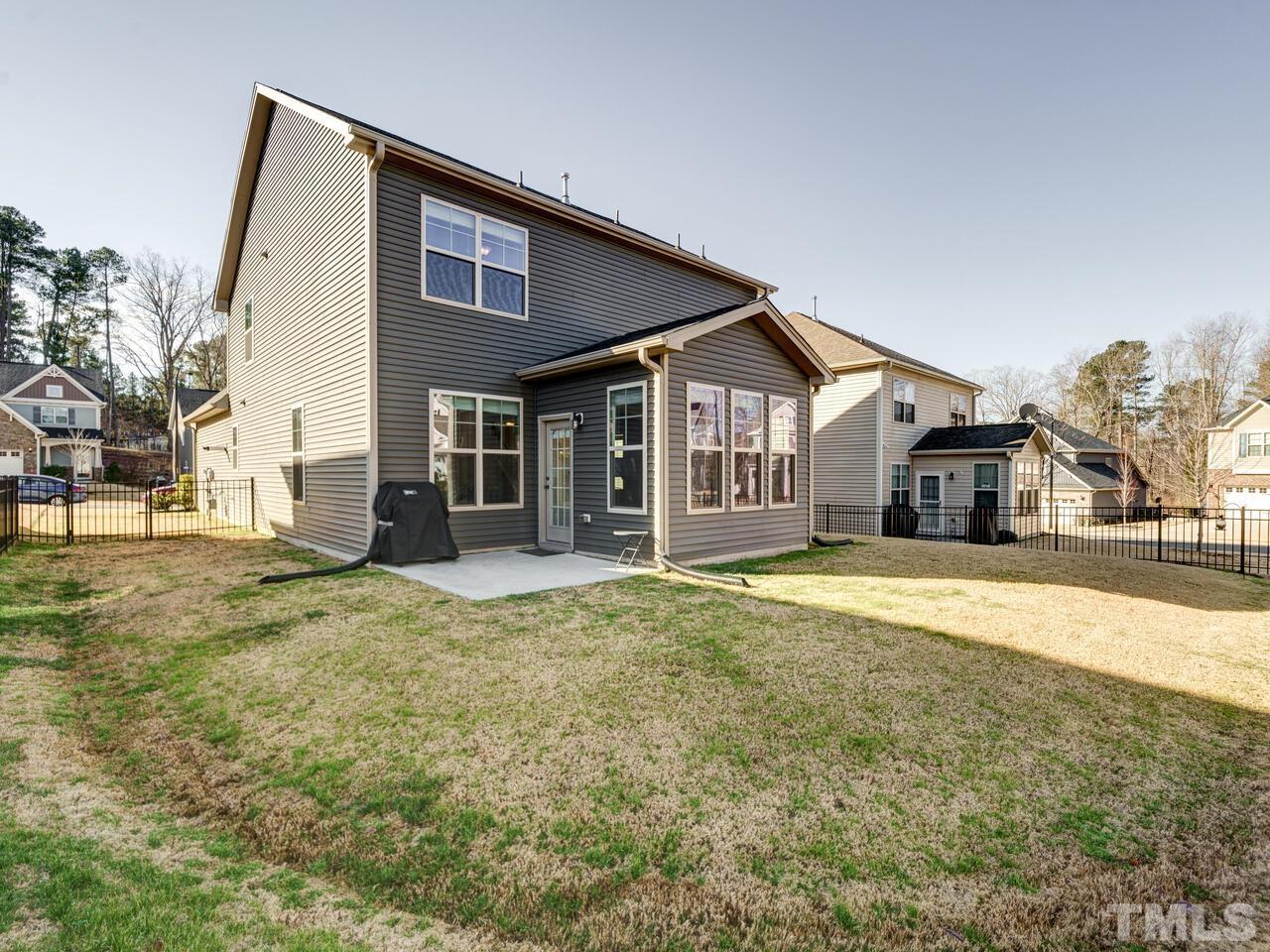 207 Maple Walk Street Durham, NC 27703 - Photo 45 of 50 a front view of a house with a yard