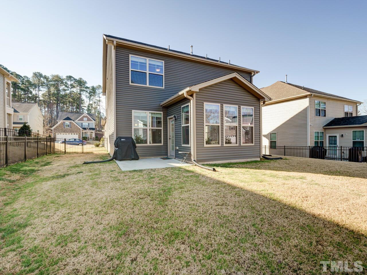 207 Maple Walk Street Durham, NC 27703 - Photo 48 of 50 a view of a house with a patio