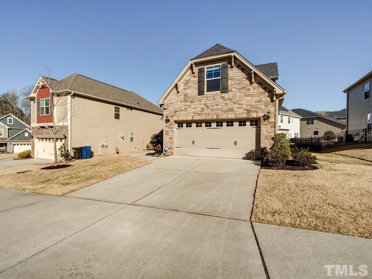 207 Maple Walk Street Durham, NC 27703 - Photo 50 of 50 a front view of a house with a garage