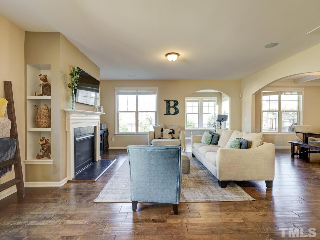 207 Maple Walk Street Durham, NC 27703 - Photo 10 of 50 a living room with furniture and a fireplace