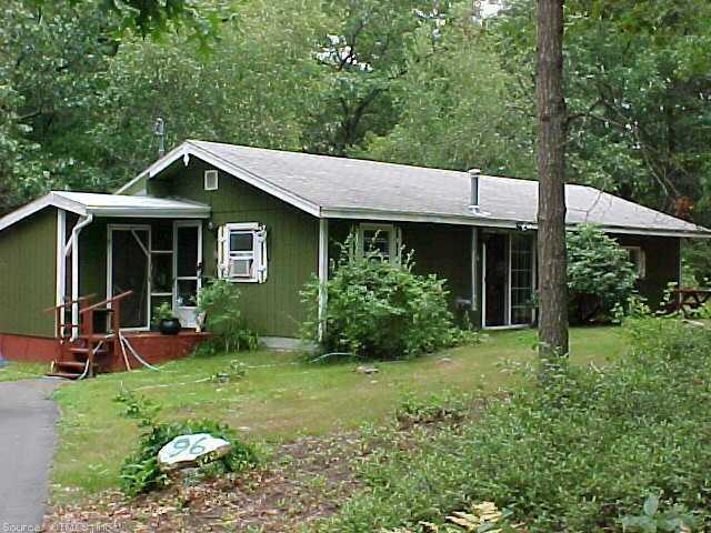 96 Buckeye Brook Road Charlestown, RI 02813 - Photo 1 of 1 a front view of a house with garden