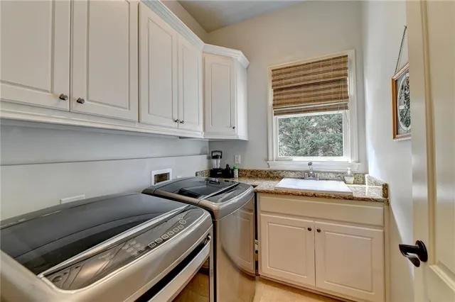 a kitchen with stainless steel appliances granite countertop a stove a sink dishwasher and a refrigerator