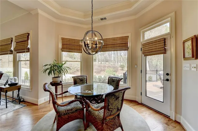 a large kitchen with stainless steel appliances granite countertop a stove and a wooden floors