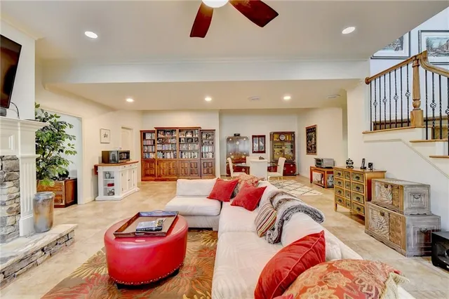 a living room with fireplace furniture and a flat screen tv