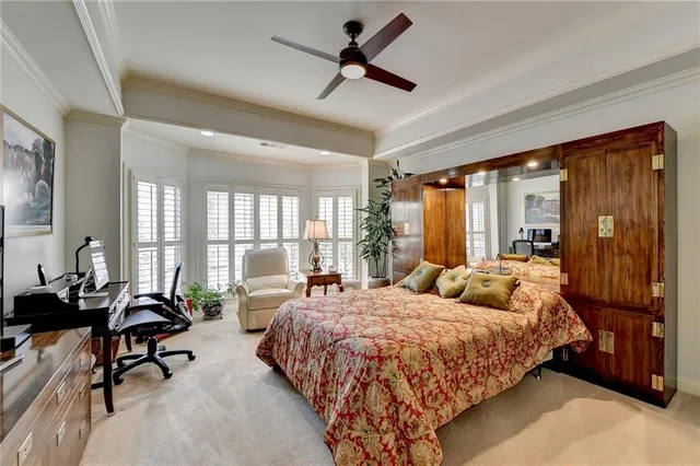 a bathroom with a granite countertop sink toilet mirror and bathtub