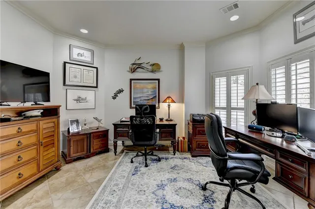 a bathroom with a granite countertop sink a toilet and shower