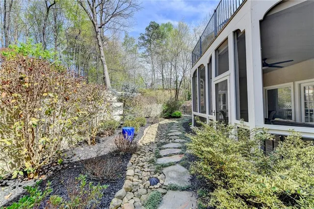 front view of a brick house with large windows