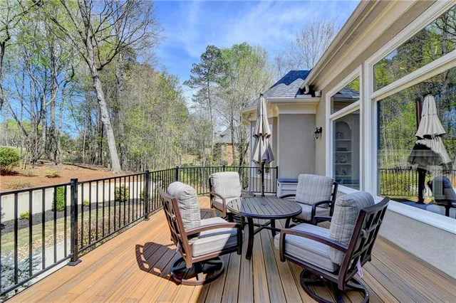 an aerial view of a house with a yard basket ball court and outdoor seating