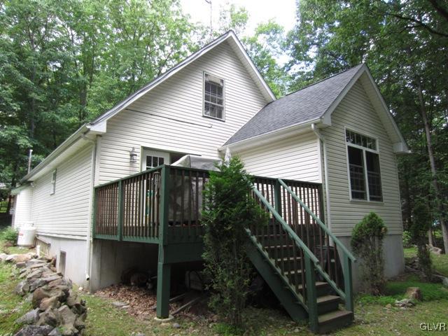 1110 Cameron Road Effort, PA 18330 - Photo 6 of 46 a front view of house with stairs and trees around