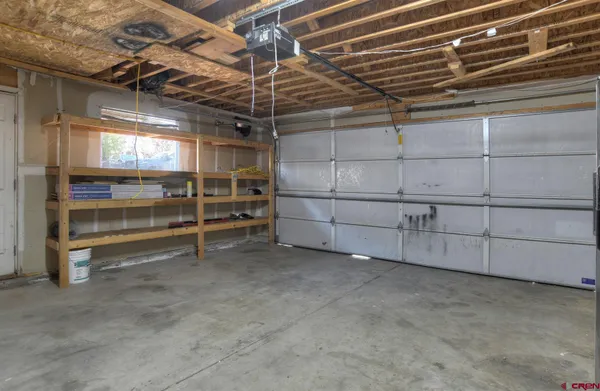 a view of an empty room with a fireplace
