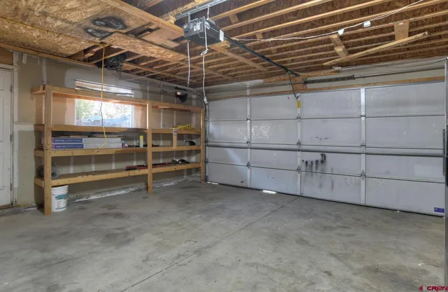 a view of an empty room with a fireplace