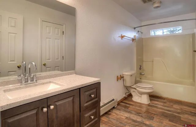 a backyard of a house with barbeque oven