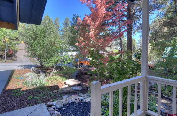 a view of a backyard of the house