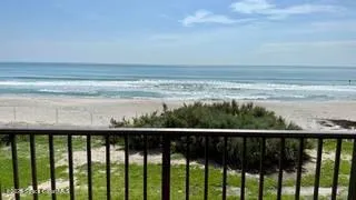 a balcony with an outdoor space