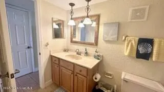 a view of a bathroom from a hallway