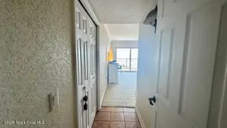 a bedroom with a bed and a flat tv screen