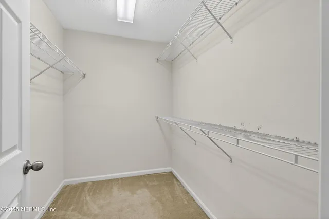 a view of a room with racks on the wall